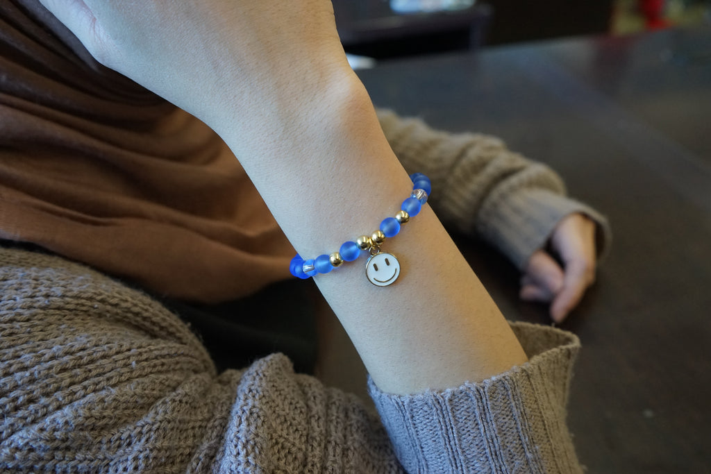 Women's Blue Bracelet with White Smiley Face