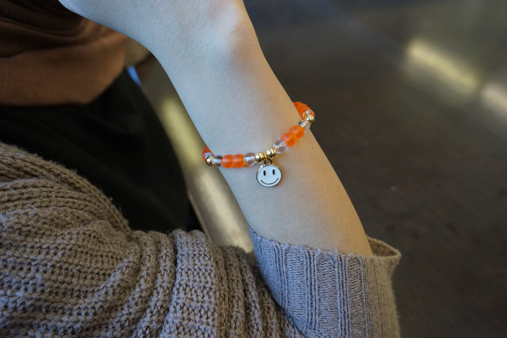 Women's Tangerine Bracelet with White Smiley Face